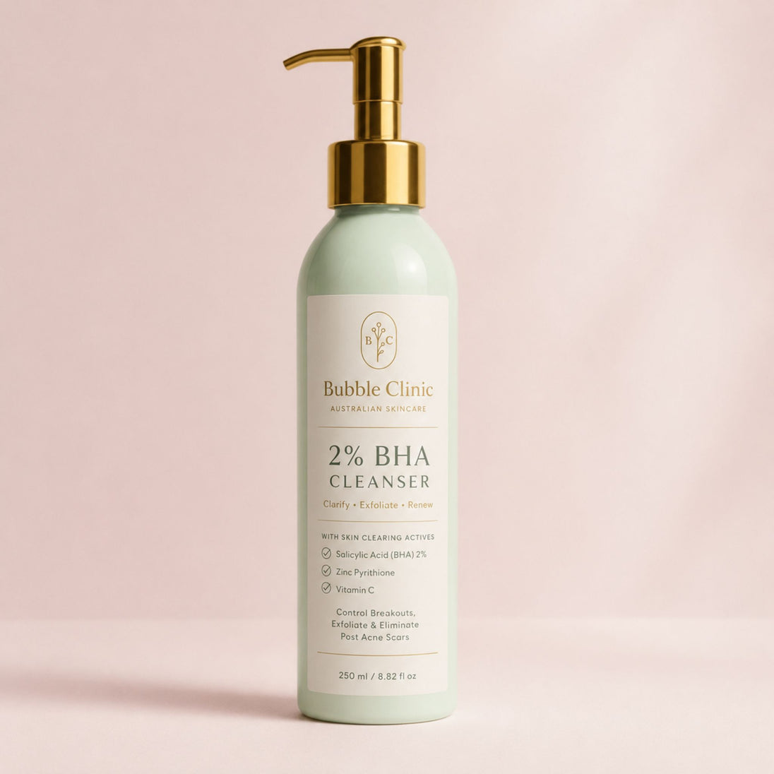 Bubble Clinic 2% BHA Zinc Pyrithione Cleanser premium studio hero image featuring a sage green bottle with gold pump and 2% salicylic acid, zinc pyrithione, niacinamide and vitamin C for clearer-looking skin.