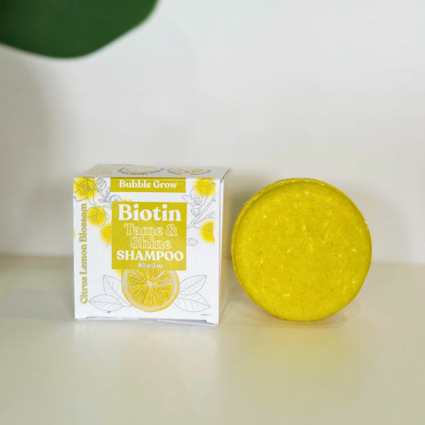 close up of biotin, turmeric shampoo bar enriched with hair-loving botanicals like Turmeric, Rice Protein, Biotin, and Saw Palmetto. This solid shampoo gently cleanses with coconut-derived surfactants while taming frizz, enhancing smoothness, and supporting scalp health.