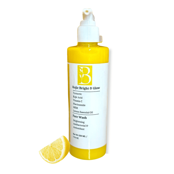 Brightening turmeric kojic acid face wash in a biodegradable pump bottle with bright yellow turmeric cleanser, organic lemon.