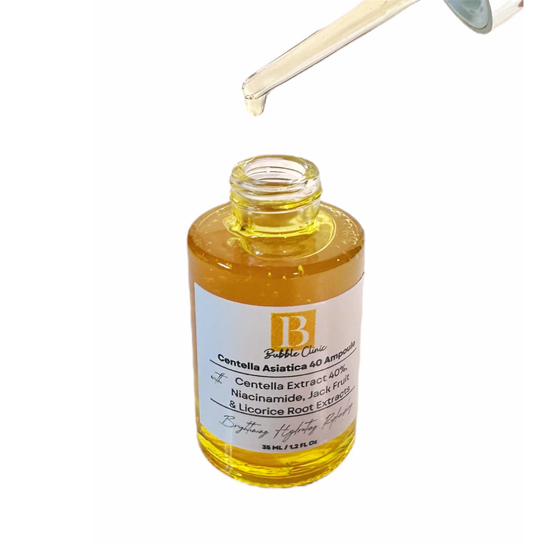 Close-up of open Centella Ampoule bottle with dropper, label text visible highlighting Centella Extract 40%, Niacinamide, Jackfruit Extract, and Licorice Root Extract.