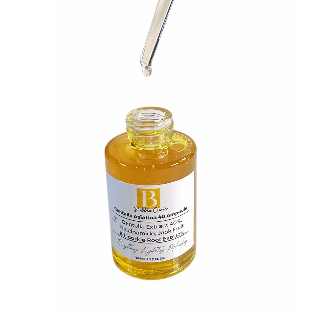 Open Centella Ampoule bottle with dropper releasing clear, lightweight serum into the bottle.