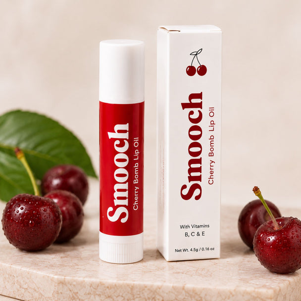 Smooch Cherry Bomb tinted lip oil with white carton packaging and cherry styling