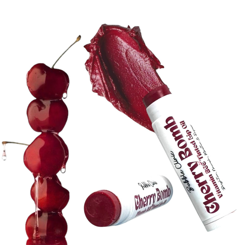 Cherry Tinted Vitamin C Lip Balm tubes with a glossy swatch and fresh cherry styling