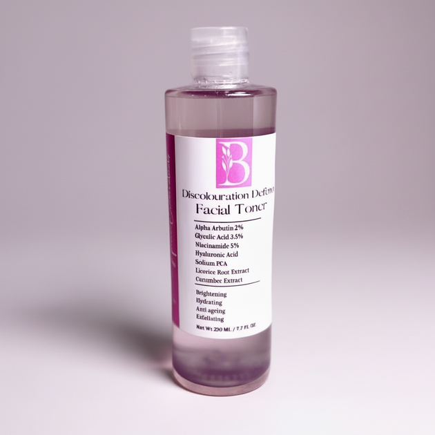 Discolouration defence Facial toner bottle with alpha arbutin and niacinamide and botanical extracts with a label on a gray background representing best skin brightening treatments Australia.
