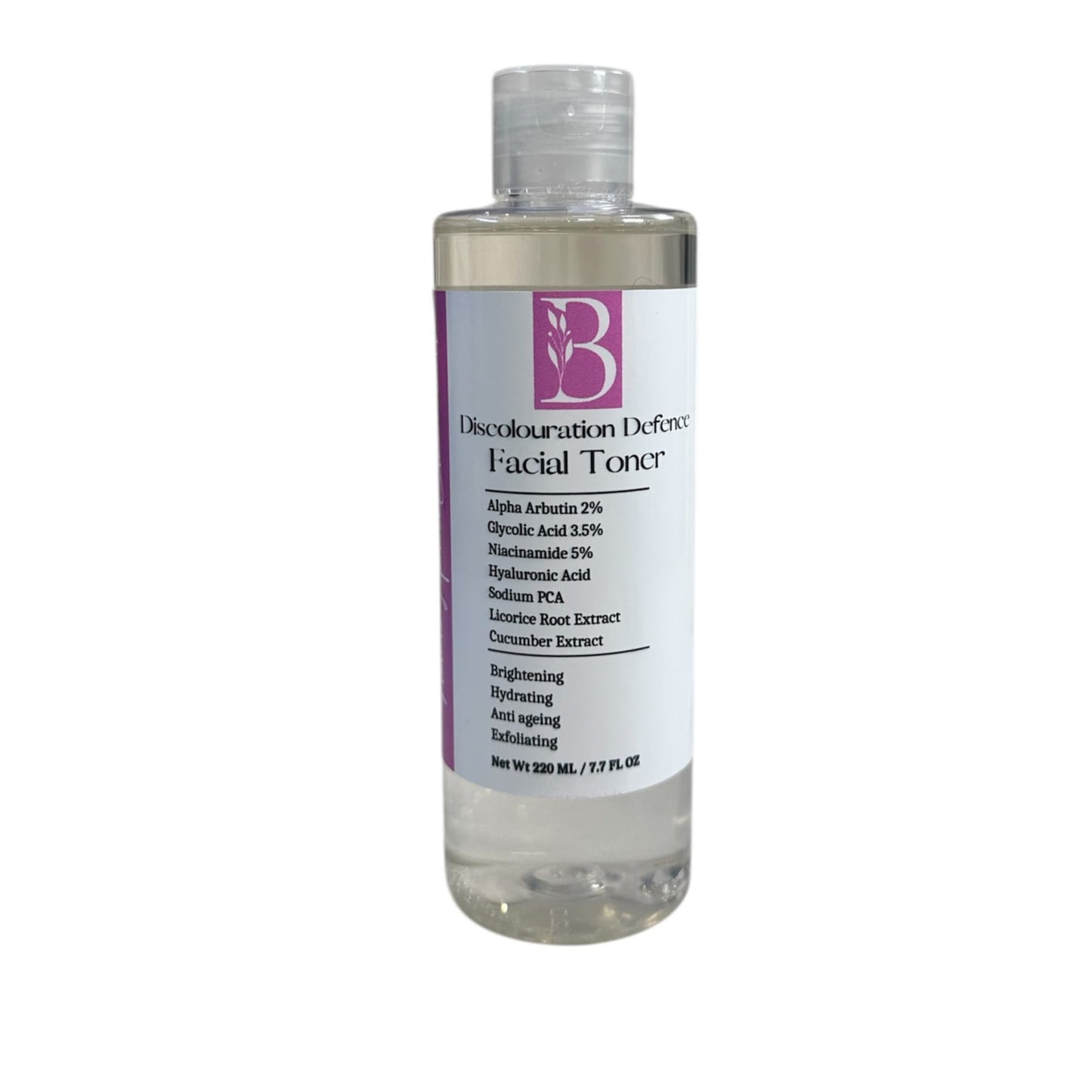 Close-up of Discolouration Defence Toner bottle on white background with visible label showing natural ingredients and benefits like brightening, hydrating, exfoliating, and anti-aging.