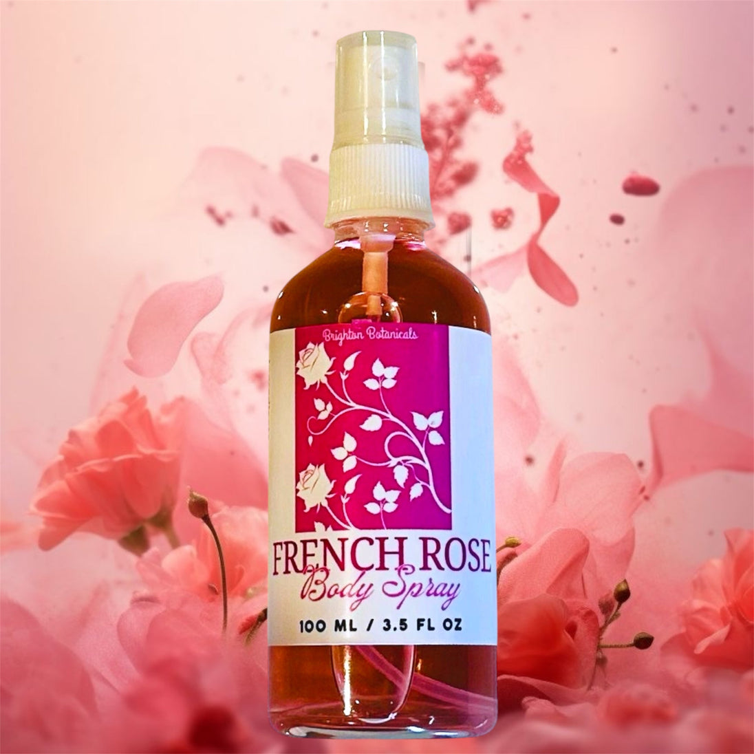French Rose Body Fragrance Mist bottle displayed against a pink background with pink roses and rose petals, emphasizing its romantic and floral essence.