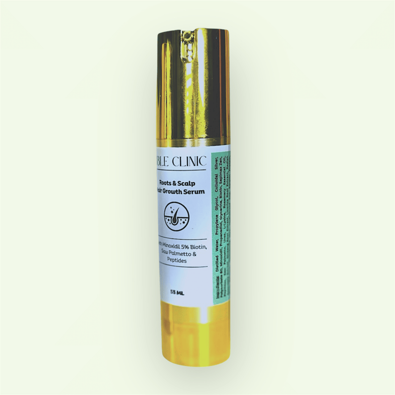 gold bottle of minoxidil hair and scalp serum against white background and rosemary twigs in the foreground