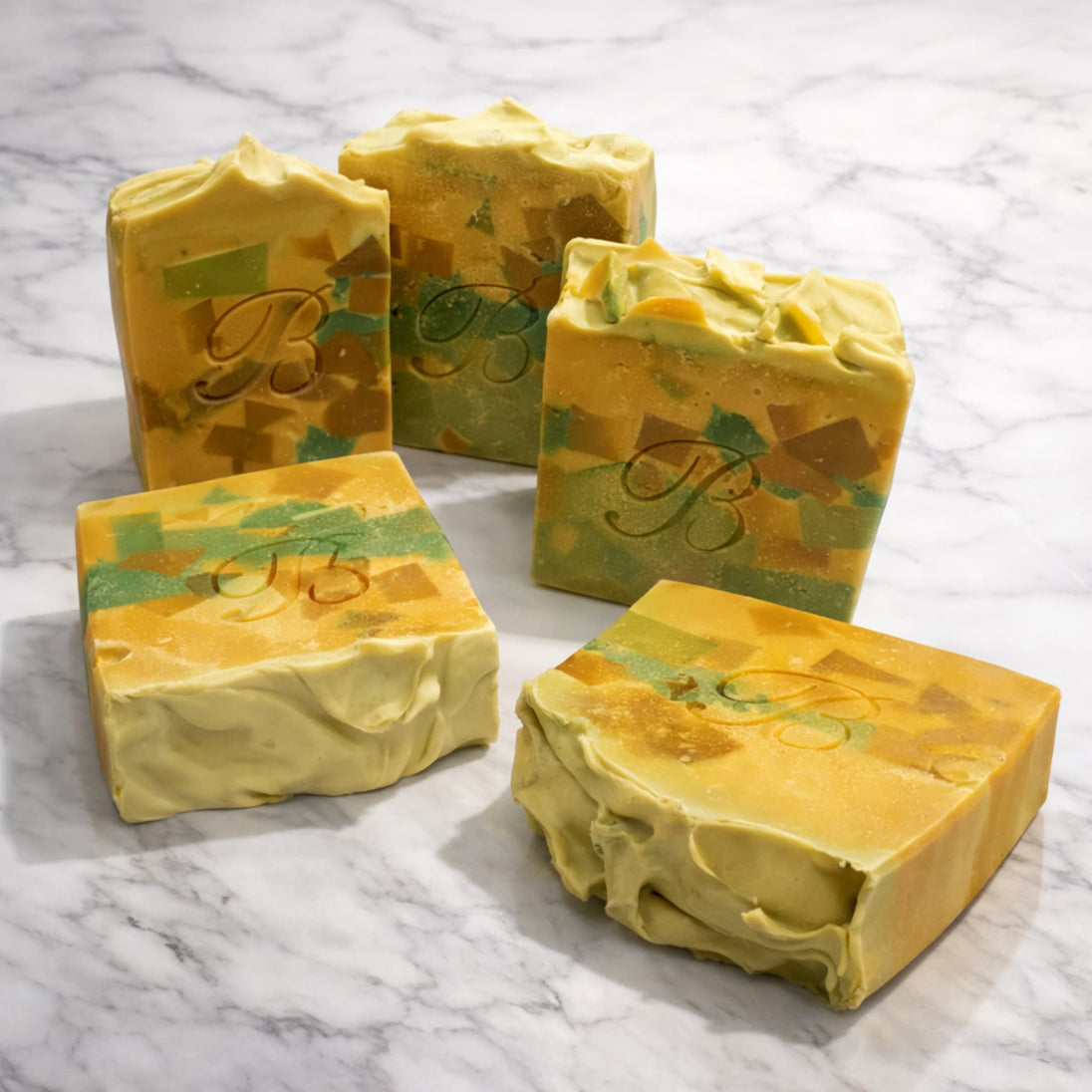 Close up of natural brightening Turmeric Kojic acid soap with Niacinamide for even skin tone on a marble surface representing best brightening soaps Australian made. 