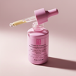 Pink skincare serum bottle with dropper on a beige background representing best Australian-made vitamin-c brightening serum.
