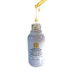 Dropper over serum bottle dispensing light, bright, rich oil into a white bottle, highlighting the luxurious texture of the Vitamin C face oil.