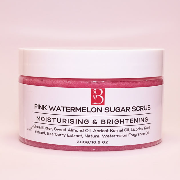 Close-up of Pink Watermelon Brightening Sugar Scrub in a sealed white-lid tub against a clean white background, highlighting its nourishing exfoliating formula.