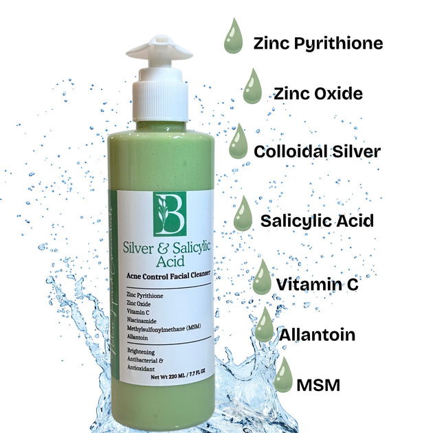 natural product image clear pump bottle of acne control zinc pyrithione cleanser with glycolic and salicylic acids revealing light green hue of spirulina and comfrey and list of ingredients to fight acne.