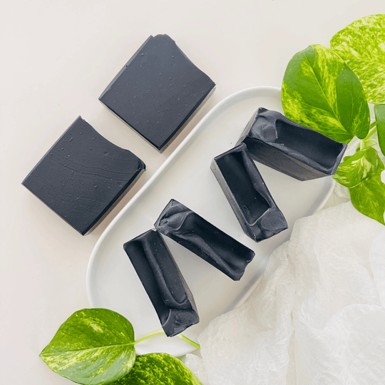 Top view of natural activated charcoal soap with with botanicals showcasing natural Australian skincare.