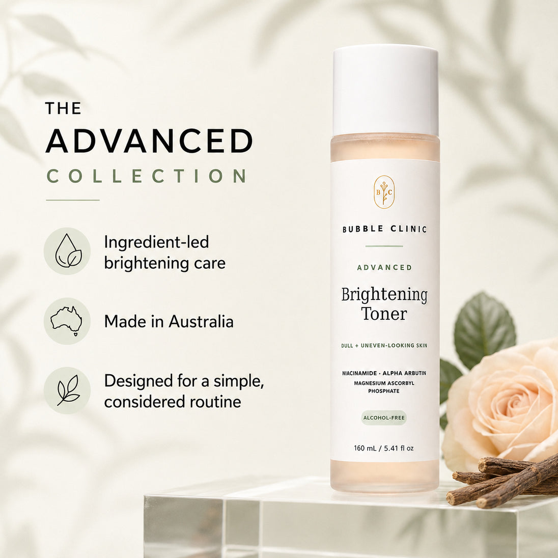 Bubble Clinic Advanced Brightening Toner bottle displayed on a clear acrylic pedestal with promotional text on the left and a pale rose with cinnamon sticks on the right, set against a soft cream background with leafy shadows.