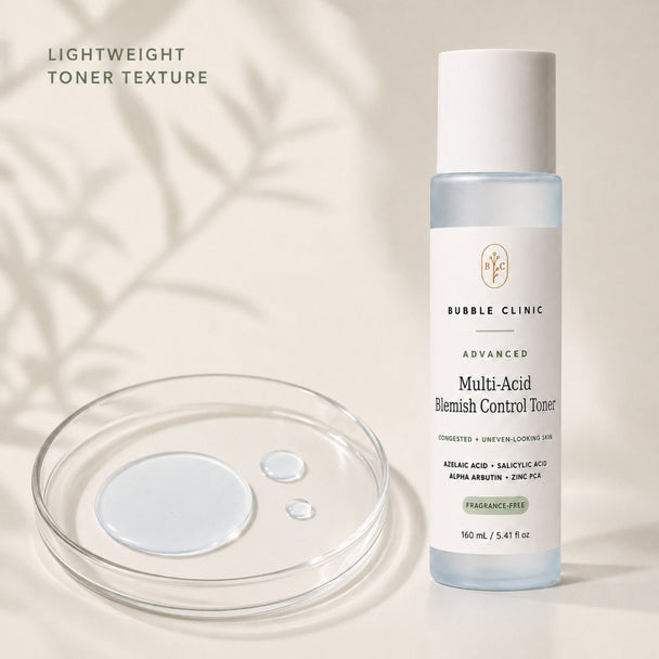 Bubble Clinic Advanced Multi-Acid Blemish Control Toner bottle shown next to a clear petri dish with liquid droplets on a warm beige background with soft leaf shadows.