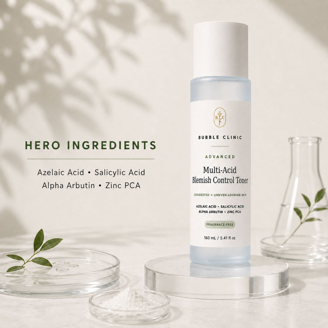 Bubble Clinic Advanced Multi-Acid Blemish Control Toner bottle displayed on a clear acrylic pedestal, surrounded by cosmetic props including glass dishes with leaves and powder, and a small glass beaker, with text detailing the hero ingredients on the left.