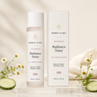 Advanced Radiance Toner 160 mL frosted bottle with its tall narrow muted-blush carton