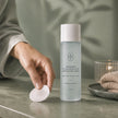 AHA exfoliating toner 150 mL evening skincare routine with cotton pad – Bubble Clinic Australia