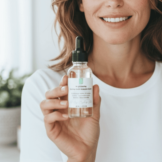 smiling woman holding a galss dropper bottle of matrixyl 3000 and alpha arbutin serum for hyperpigmentation revealing the serum's clear hue and light texture
