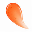 Apricot Glow tinted lip oil swatch in sheer orange peach gloss
