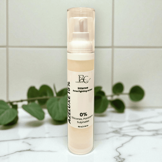 Azelaic Acid 15 percent Skincare product bottle with brand logo on a marble surface with green leaves in the background