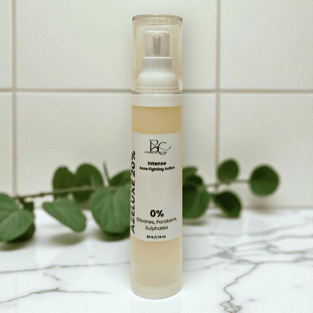 Azelaic Acid anti acne Skincare bottle with label on a marble surface with green leaves in the background