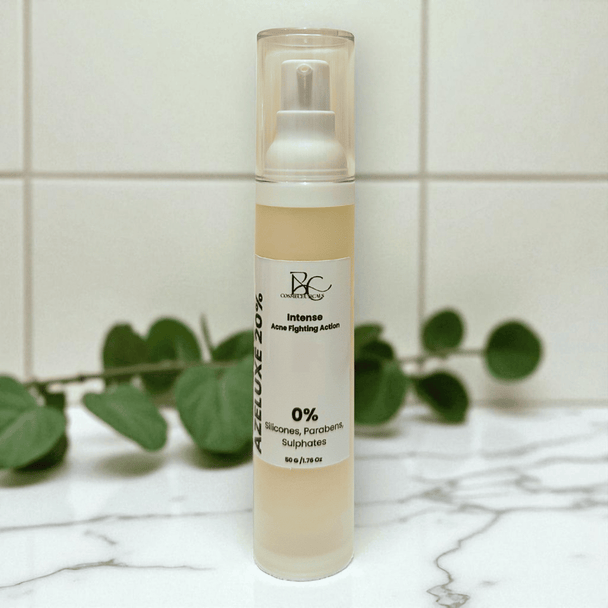Azelaic Acid anti acne Skincare bottle with label on a marble surface with green leaves in the background