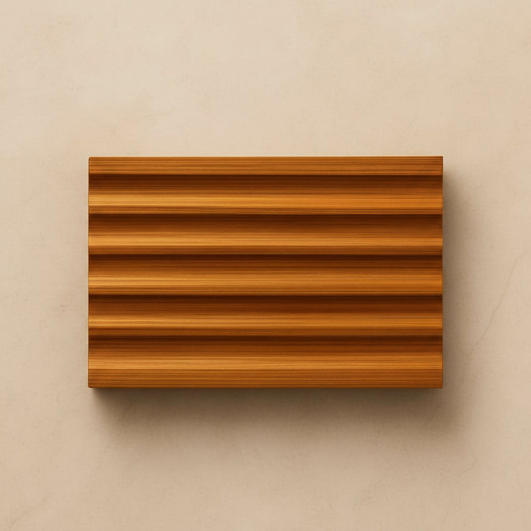 natural bamboo soap dish on light beige background.