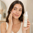 Woman applying Bubble Clinic Barrier Bright Tone Correcting Moisturiser to her cheek