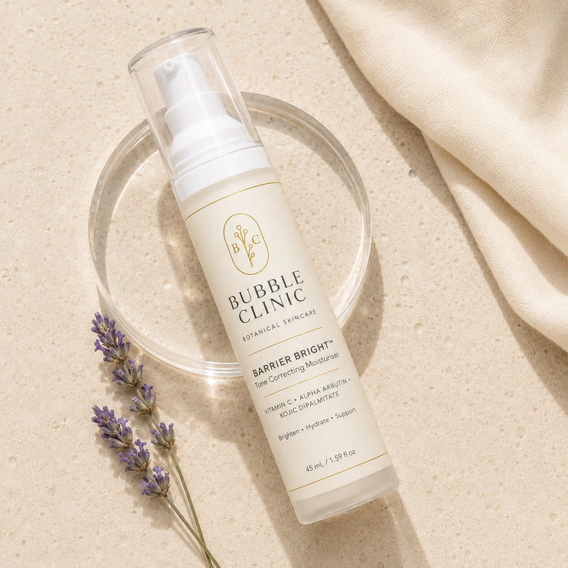 Bubble Clinic Barrier Bright 45 mL airless moisturiser flat lay with lavender and cream fabric