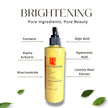 Brightening natural cleanser bottle with listed key ingredient labels: Kojic Acid, Organic Turmeric, Alpha Arbutin and more.