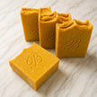 close up of four Natural Brightening Turmeric Kojic Acid Soap Bars with grass fed beef tallow, extra virgin olive oil, castor oil and coconut oil - Handmade Facial and body Cleansing Soap for Dark Spots, Acne Marks, Uneven Skin Tone and Glowing Skin Australia
