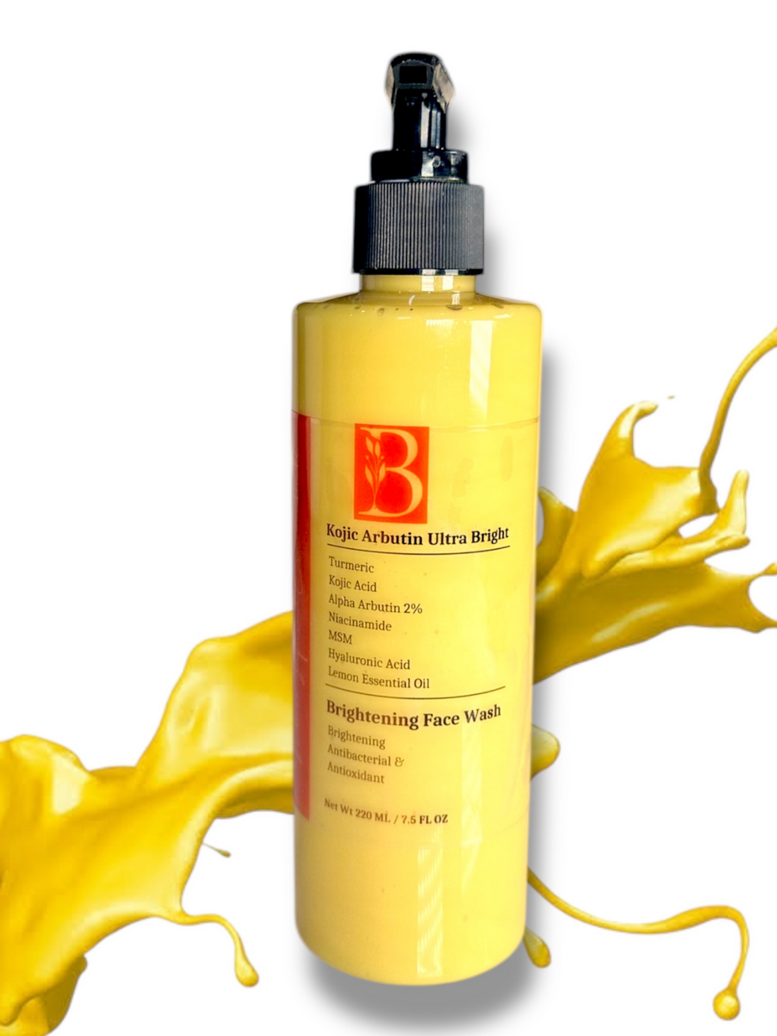 close up of bottle natural brightening kojic turmeric face wash alpha arbutin and vitamin c against white background with bright yellow splash of the creamy face wash in the background revealing bright yellow hue of organic turmeric