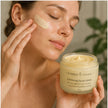 Person applying lightweight exfoliating facial cream for smoother clearer looking skin