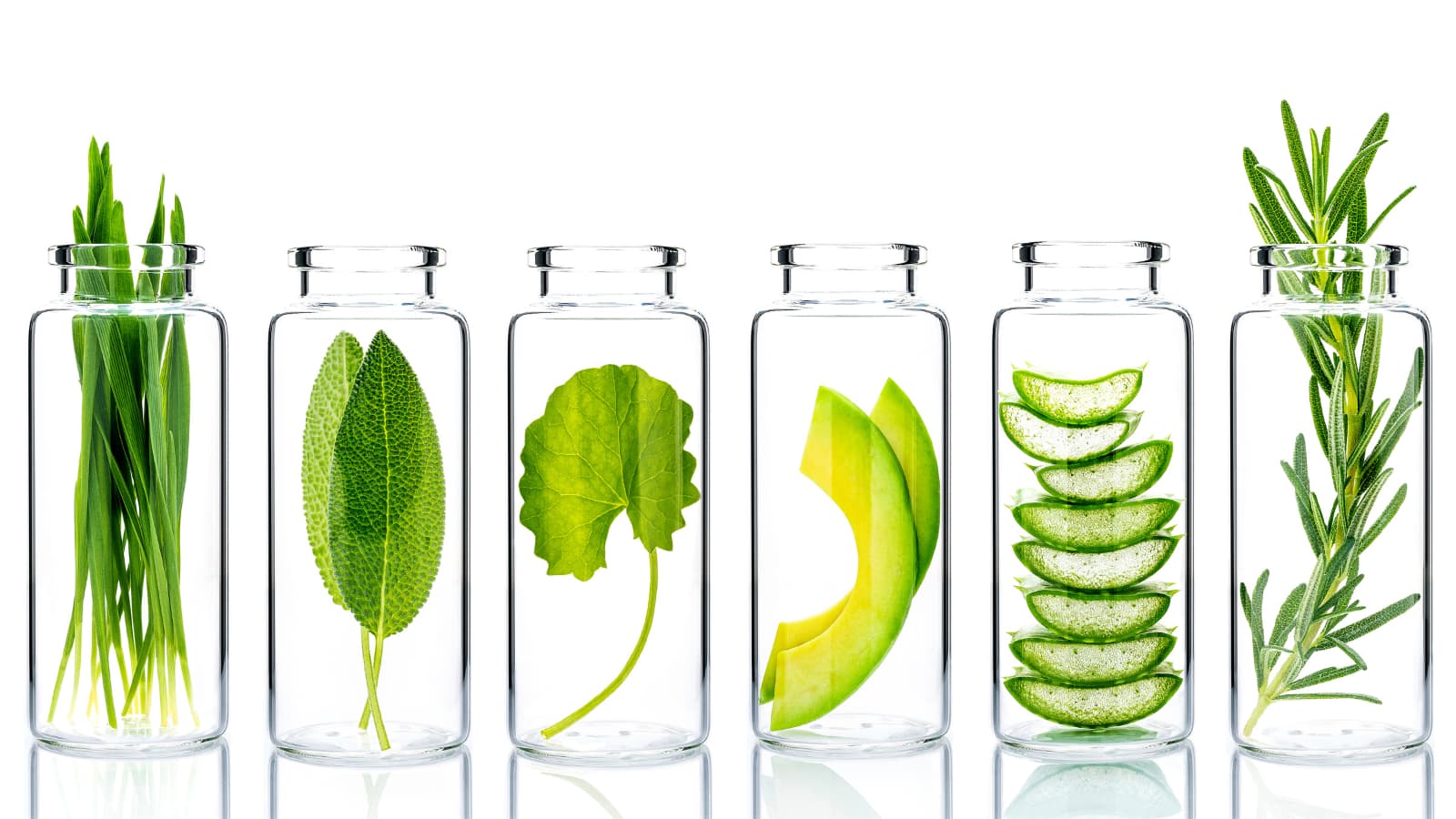 fresh botanicals in clear glass jars representing clean beauty and natural Australian Skincare and Haircare.