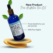 light background with tilted blue glass serum bottle of pure organic Austrlian emu oil.