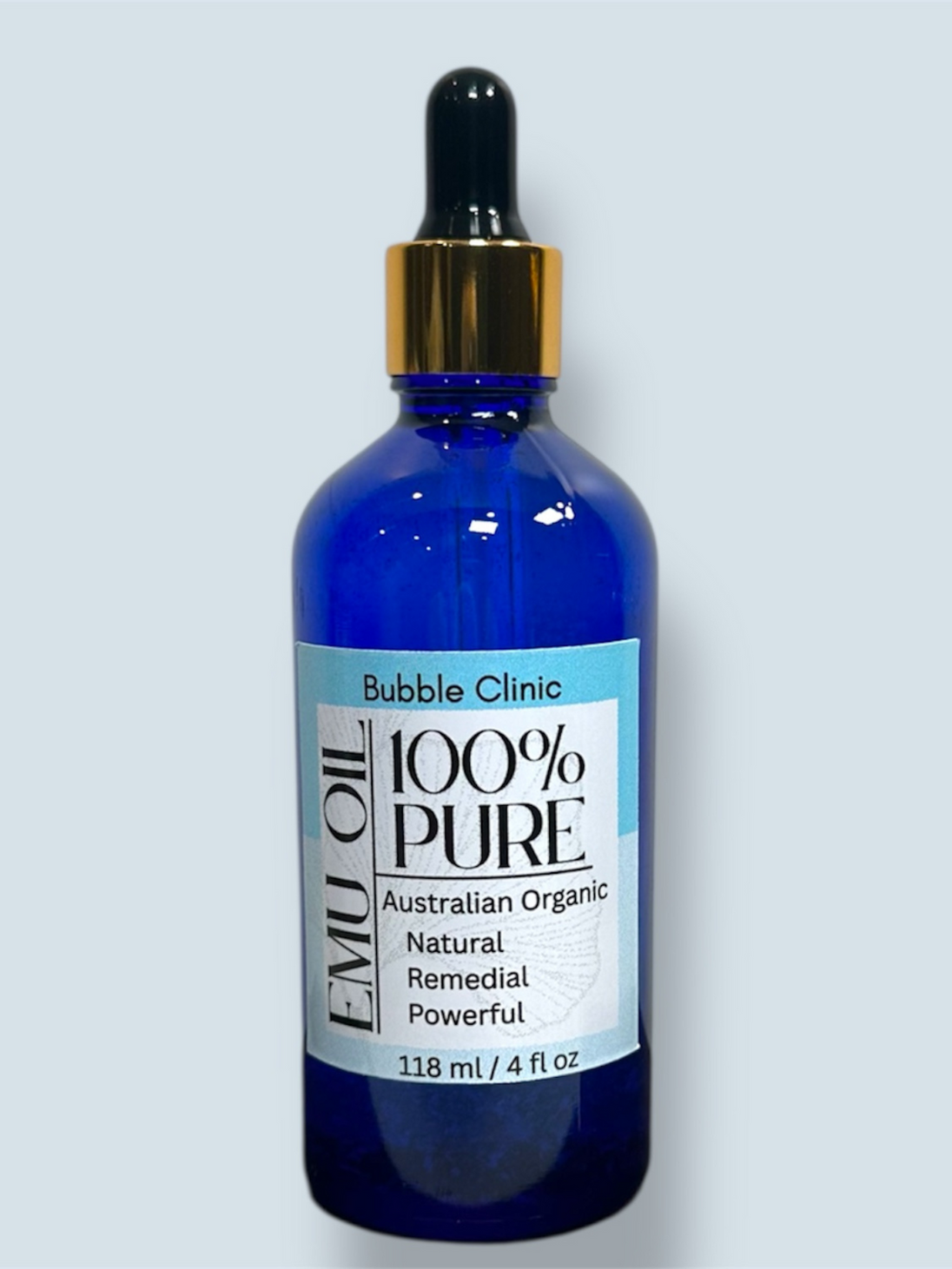 image showing blue glass bottle of natural organic australian emu oil against white background representing clean beauty and the best of naural organic australian skincare and haircare