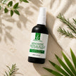 Bubble Clinic Hair and Scalp Serum flat lay with rosemary and cream towel