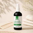 Hair and Scalp Serum bottle with treatment pump, comb and folded towels