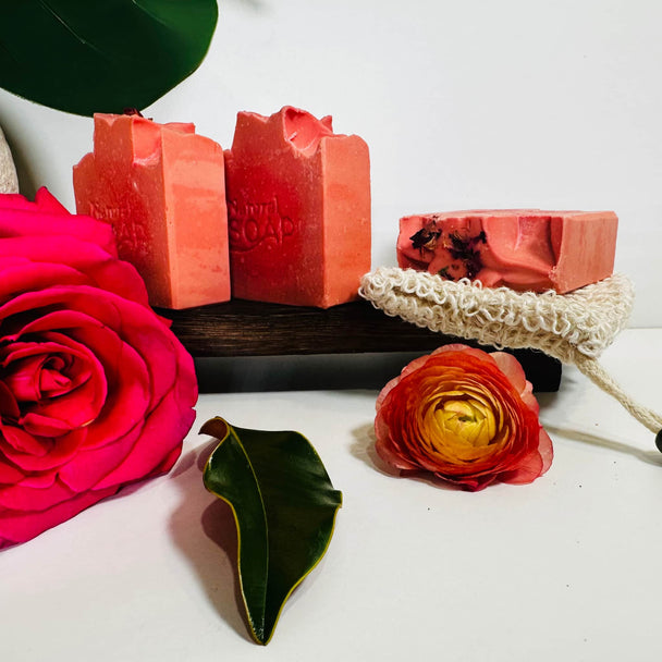 Natural Organic Himalayan Rhubarb Soa[ Bars on organic tray with Roses and Botanicals in the foreground representing natural artisan soap for sensitive skin