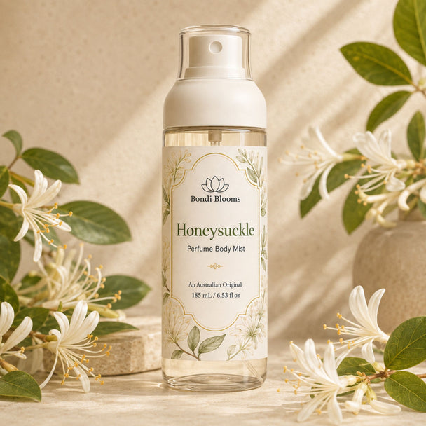 Japanese Honeysuckle Body Mist styled with creamy white honeysuckle flowers and green leaves