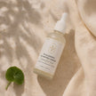 Top-down flat lay of Bubble Clinic Hyaluronic Plumping Serum in a filled 50 mL frosted bottle.
