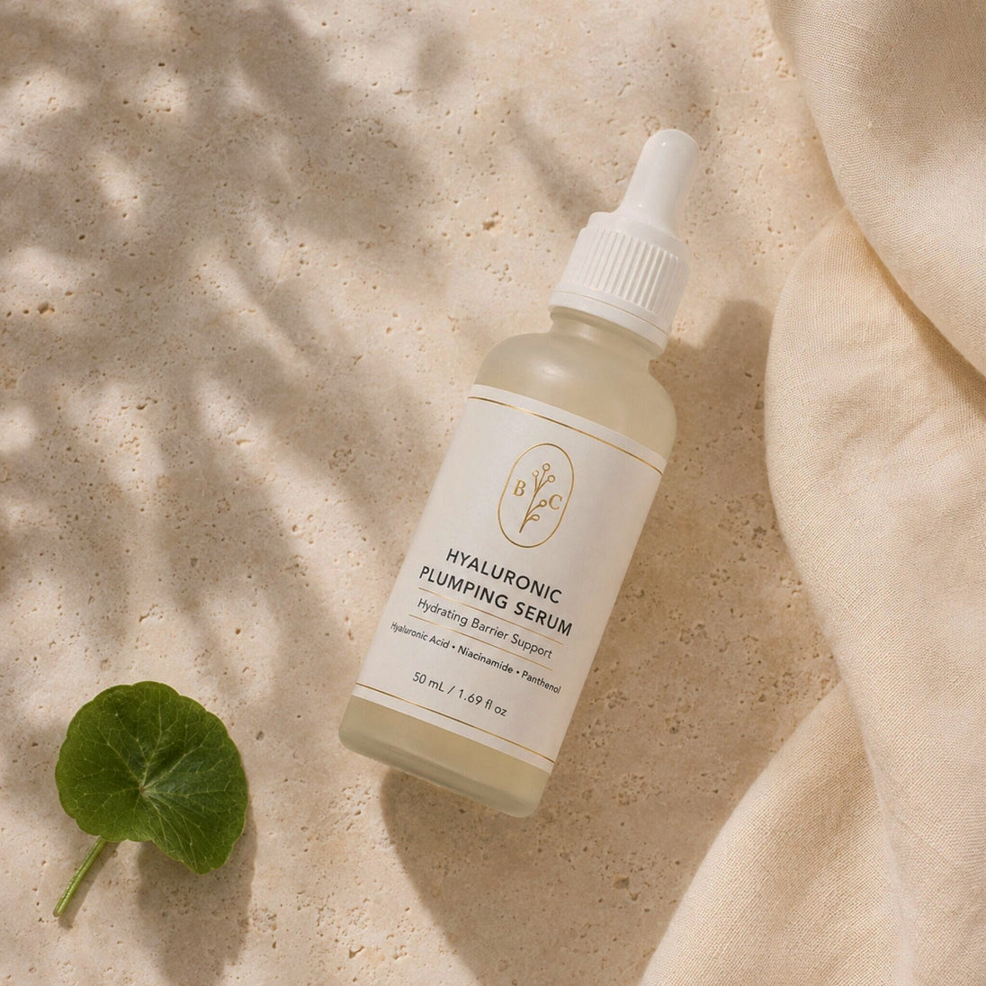Top-down flat lay of Bubble Clinic Hyaluronic Plumping Serum in a filled 50 mL frosted bottle.
