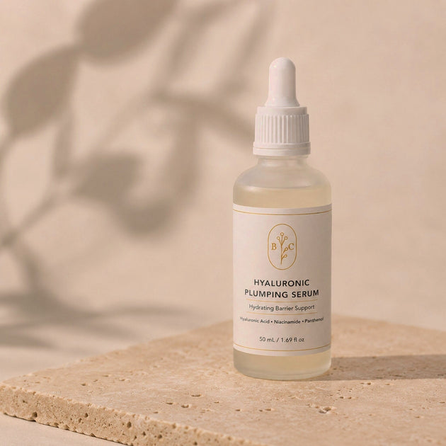 Bubble Clinic Hyaluronic Plumping Serum product on a beige stone background in a 50 mL frosted glass bottle.