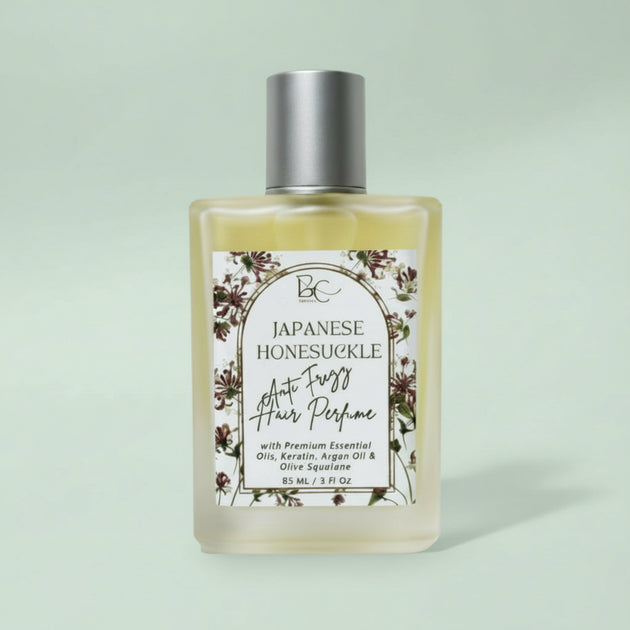 Bottle of Japanese Honeysuckle hair perfume with a floral label on a white background representing best natural hair perfume