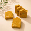 Jumbo turmeric kojic acid soap bars showing handmade texture and embossed finish