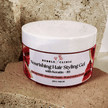 Jar of Bubble Clinic Nourishing watermelon Hair Styling Gel with Keratin and B5 on a textured surface.