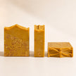 Kojic acid alpha arbutin soap shown from front side and top views