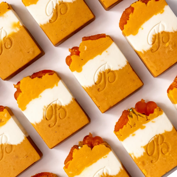 Handmade Kojic Acid Niacinamide Turmeric Soap for hyperpigmentation, acne prone skin and uneven skin tone – Australian made, flat laid on white surface