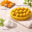 close up of turmeric kojic acid soap for dark spots and acne scars for sensitive skin for sensitive skin, vegan brightening skincare soap.